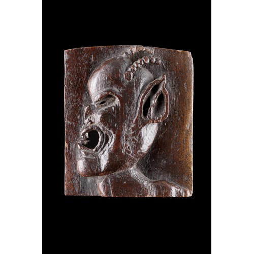 An Unusual Small Carved Plaque of a Horned Devil or ‘Demon’
